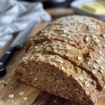 Irish Brown Bread Recipe with sliced loaf and melting butter