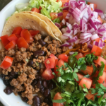 Overhead shot of homemade Chipotle burrito bowl with chicken and guacamole